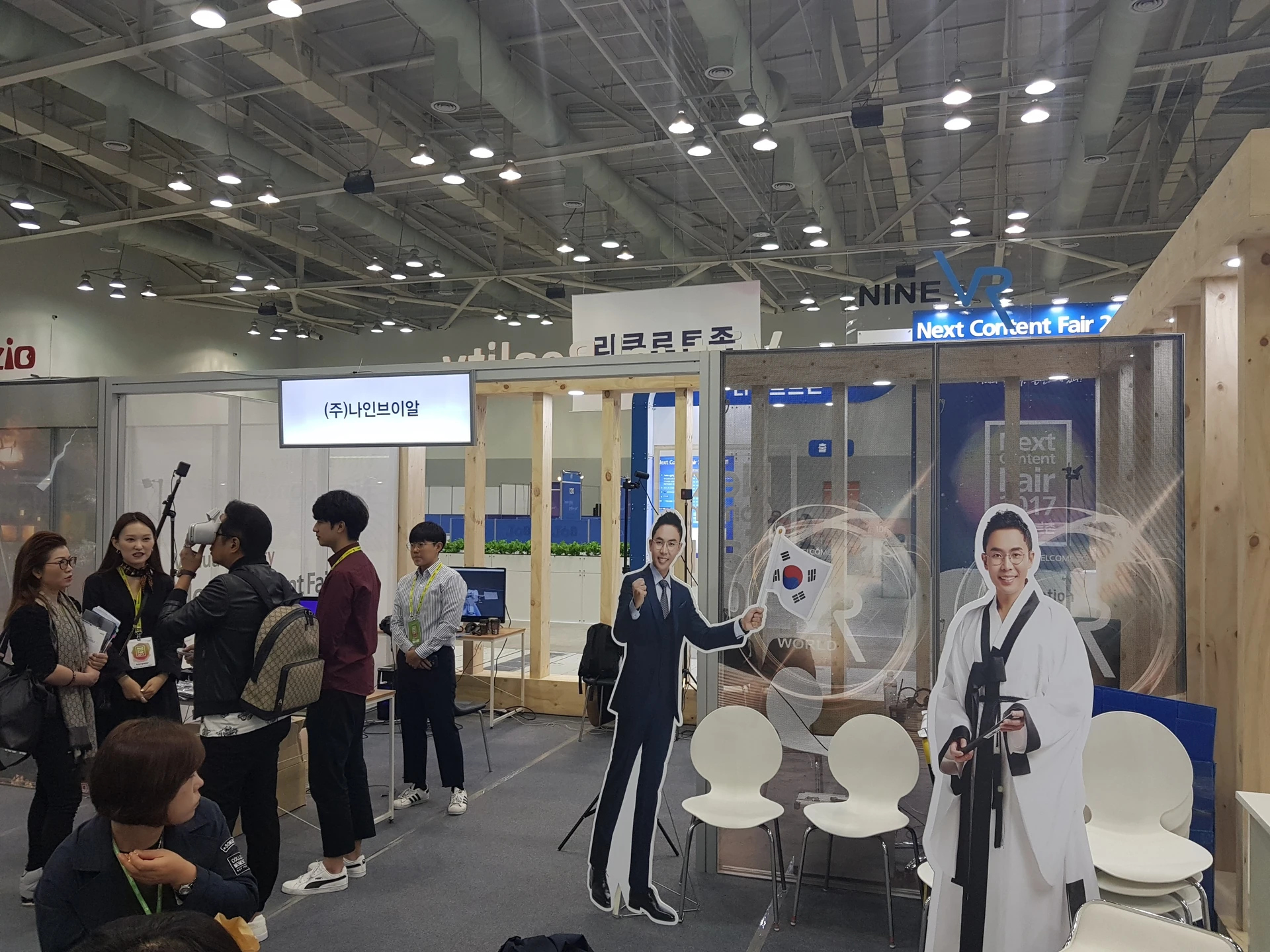 Visitors trying VR at a history exploration exhibition booth